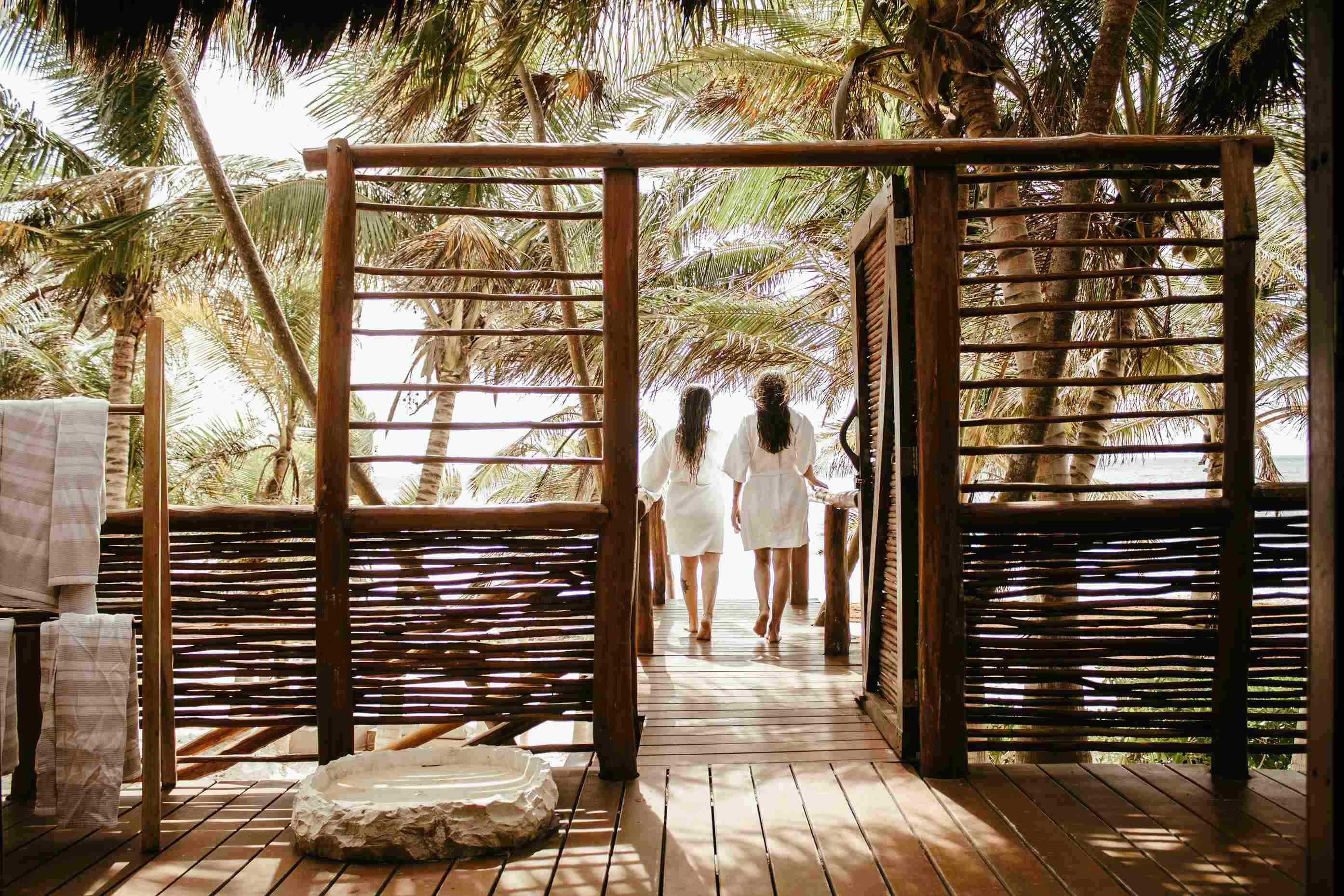 two girl walking to the beach