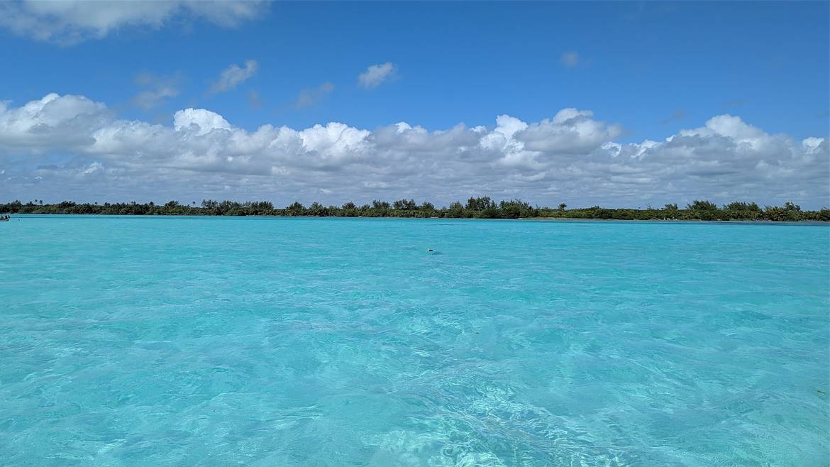 View across a wide lagoon inside the Sian Ka'an Biosphere with low mangroves and open horizon