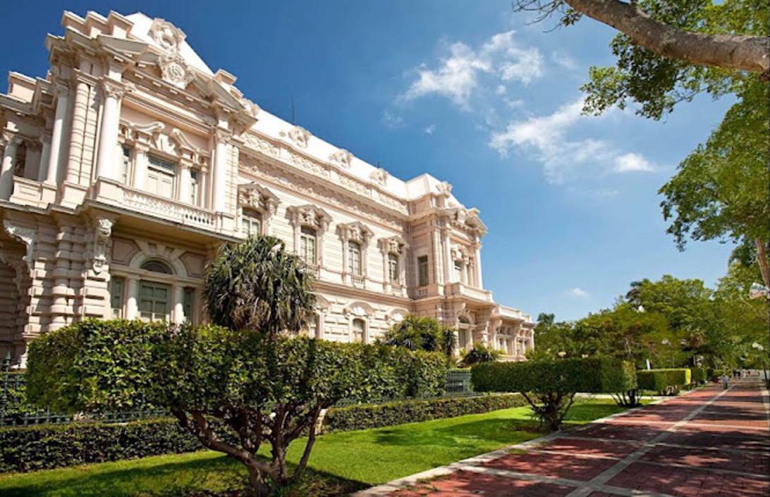 Tree-lined Paseo de Montejo boulevard in Merida with colonial mansions