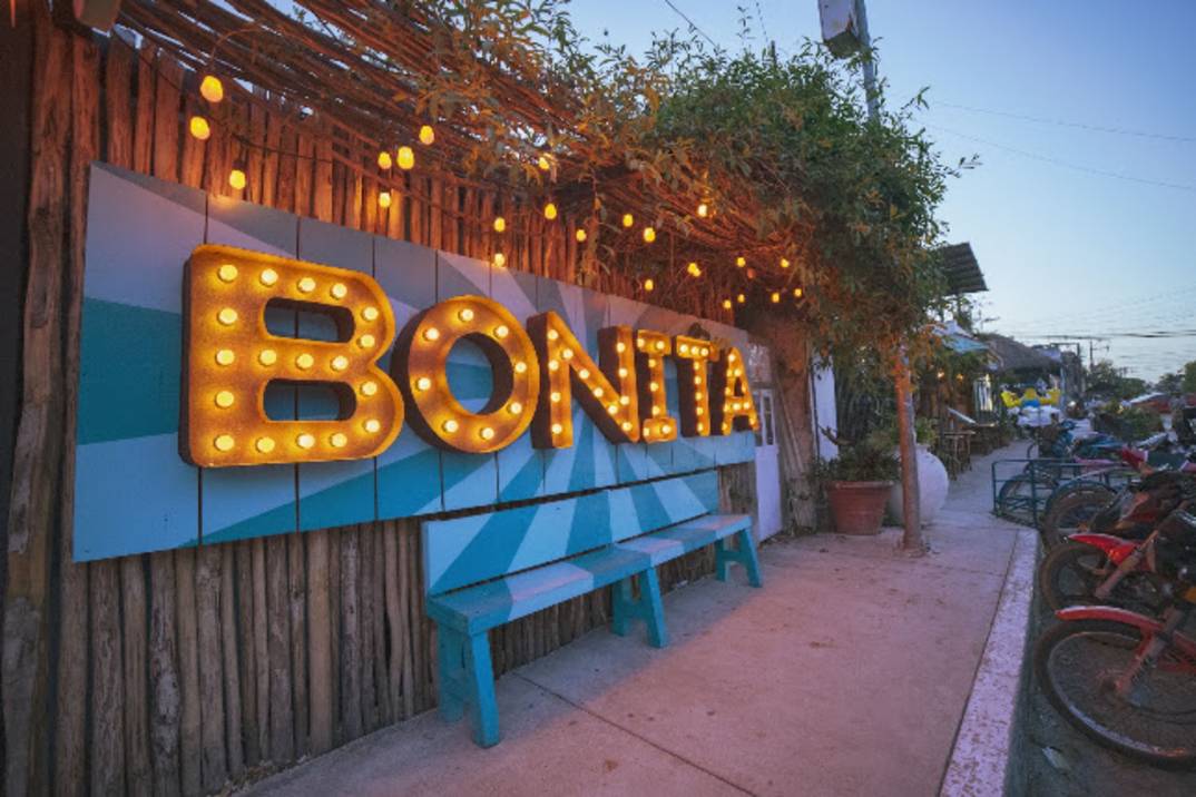 Casual burger patio with plants at BONITA in Tulum Centro
