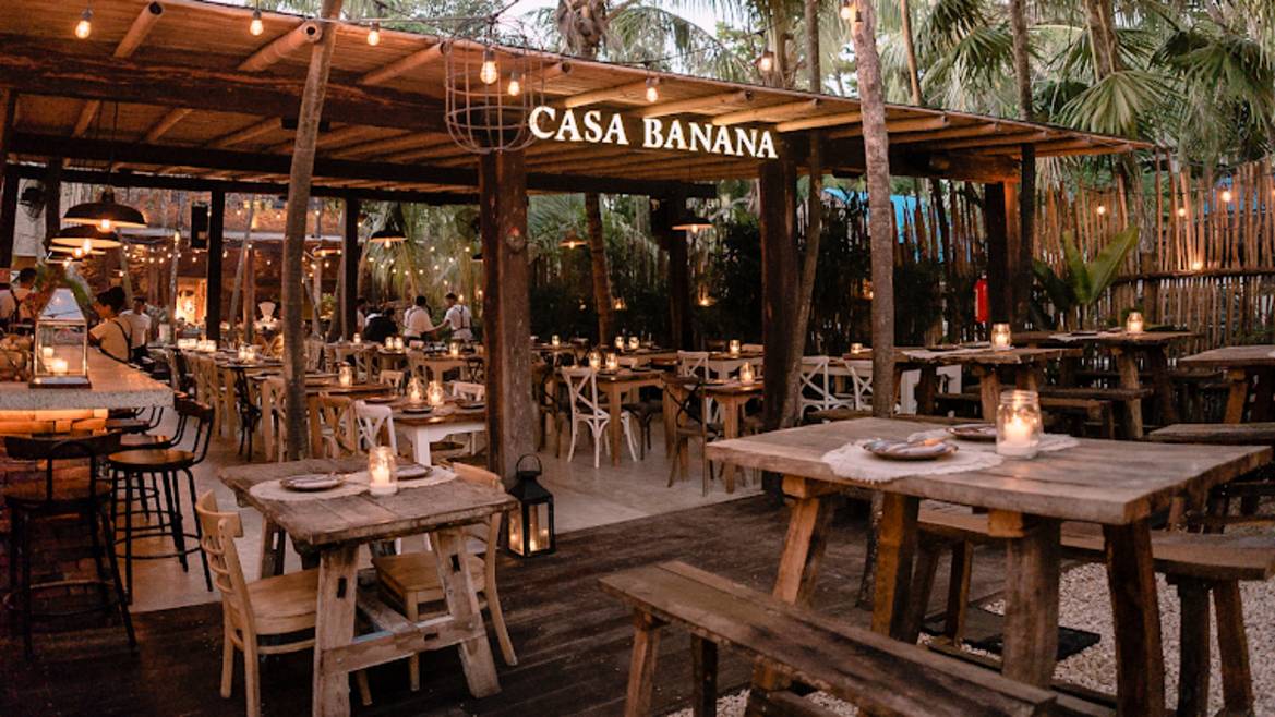 Warm open-grill dining room at Casa Banana Tulum