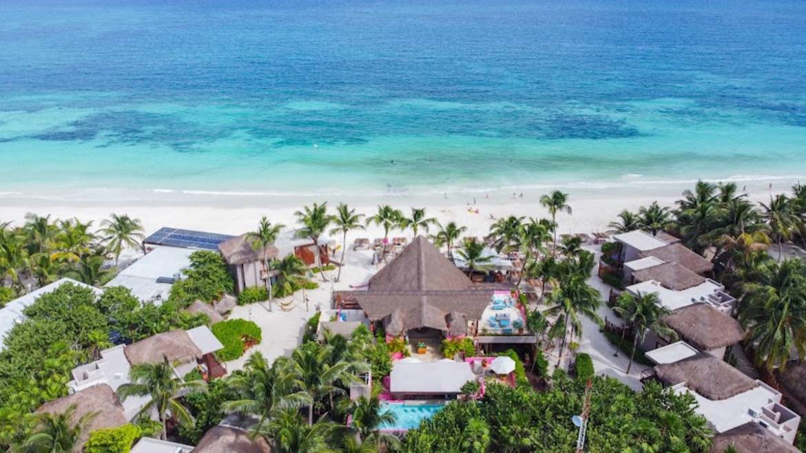 Beachfront pool and palapa lounge at La Zebra Tulum