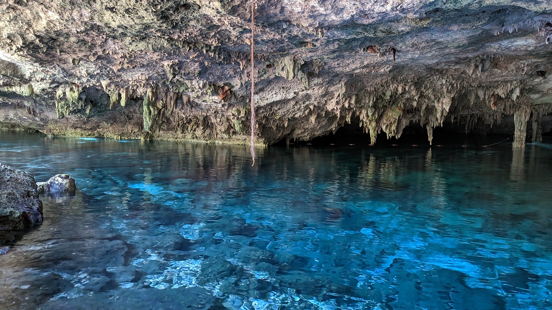 Clear blue water inside the cavern at Cenote Dos Ojos near Tulum