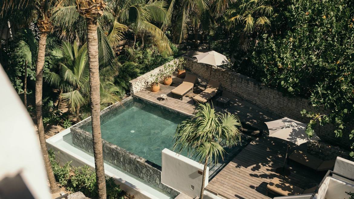 Plunge pool and sun deck in the jungle at Chiringuito Tulum