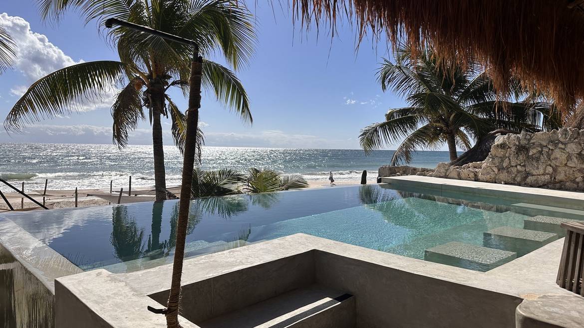 Infinity pool overlooking the beach at Delek Tulum