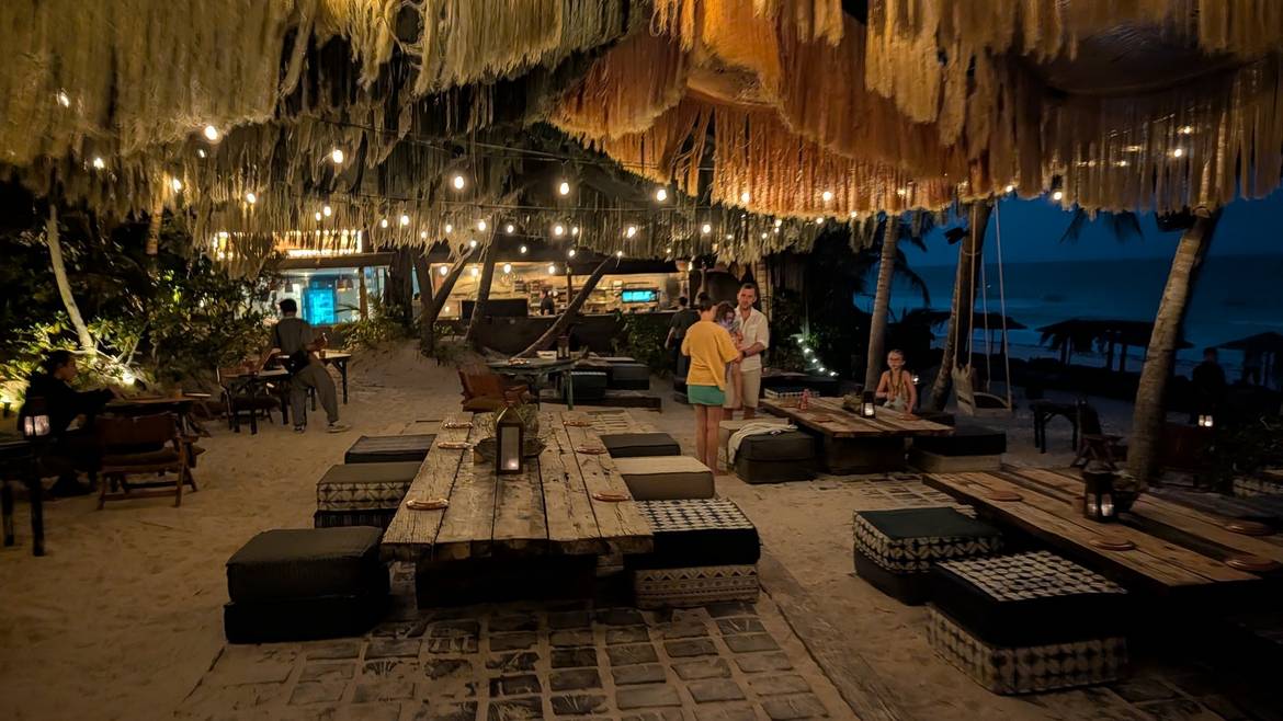 Candlelit tables in the sand at La Popular, Nômade Tulum