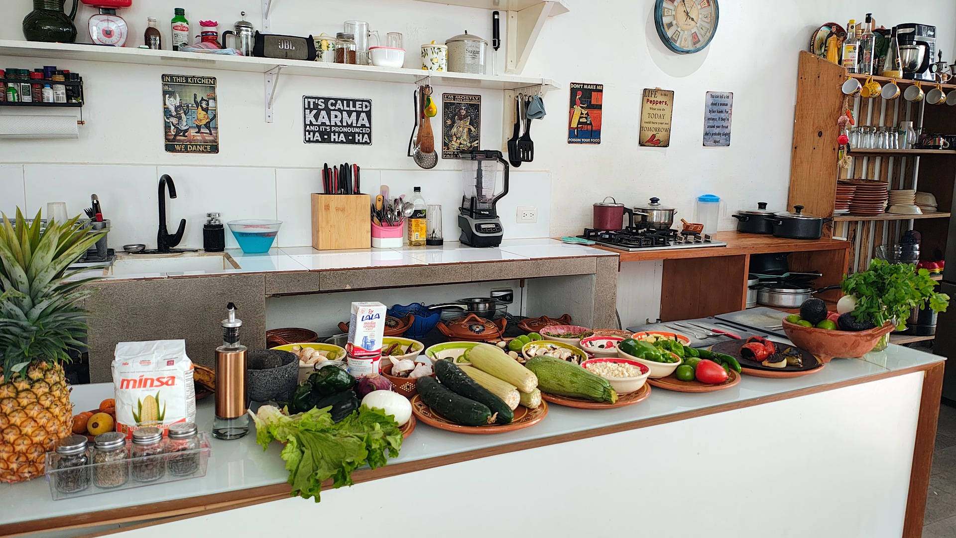 A cooking class kitchen counter set with fresh ingredients at Rivera's Kitchen in Tulum